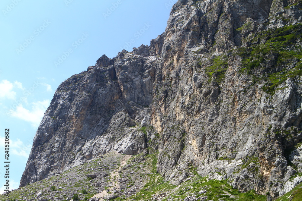 fantastic mountain slope with light blue sky, natural landscape photo