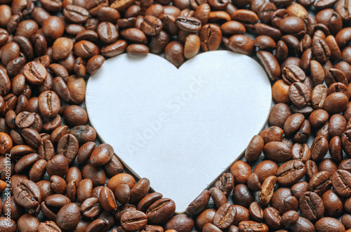 coffee beans roasted as a background with space for text as a heart