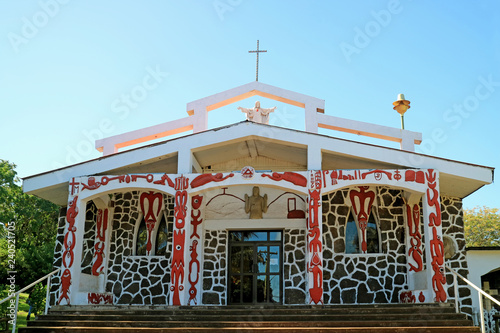 Church of the Holy Cross, which the mixture between Catholic symbolism and mythology of Rapa Nui on the main facade, Easter Island, Chile