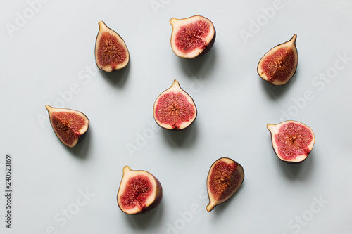 Fresh fig. Fruit with half and quarter on light background. Collection.