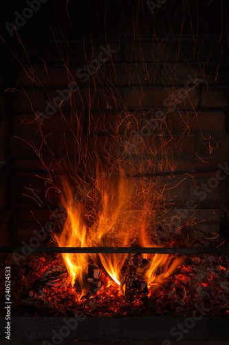 Fire and sparks in the fireplace. long exposure. The texture of fire. Background