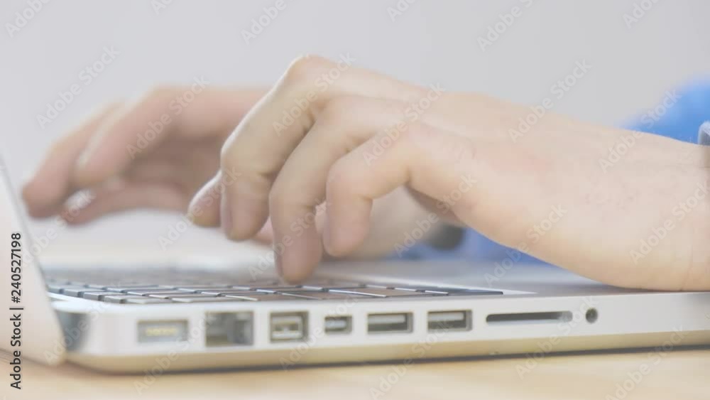 Male hands are typing a message in social networks