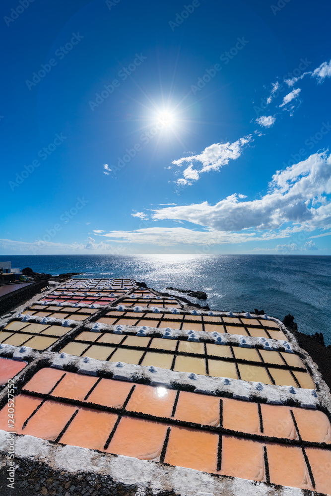The Salinas de Fuencaliente (Salt fields of Fuencaliente) in the south of the island of La Palma, Canary Islands, Spain. Flor de Sal is harvested as sea water is trapped between stone and mud.