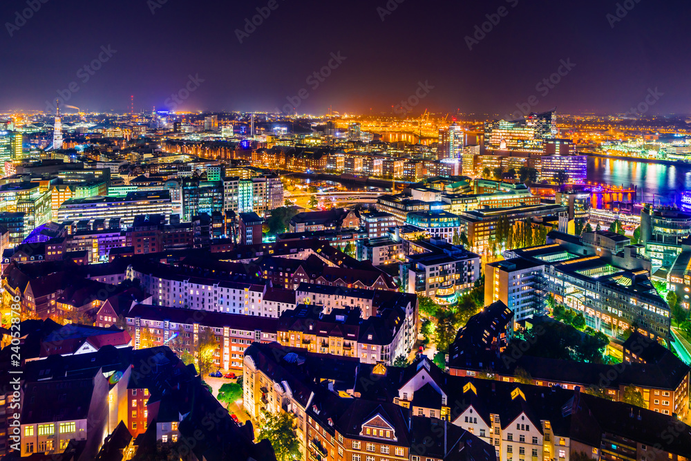 Aerial view of downtown Hamburg, Germany with the Harbor District at night.