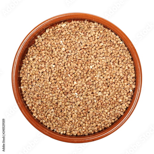 Buckwheat in clay pot isolated on white background, with top view