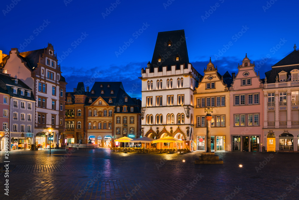 The Main Market of Trier, Germany at night. It is the center of the medieval Trier surrounded by numerous historic buildings.