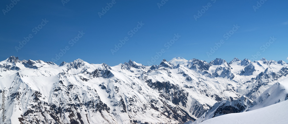 Panorama of snow covered mountains in winter