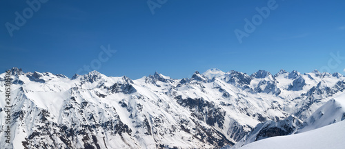 Panorama of snow covered mountains in winter