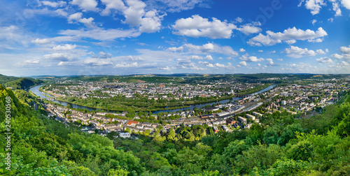 Aerial view of Trier, Germany, on a sunny summer day. Trier lies in a valley between vine-covered hills in the west of the state of Rhineland-Palatinate and within the Moselle wine region.