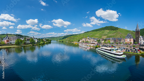 The river Moselle and Bernkastel-Kues, Germany. The twin town of Bernkastel-Kues is regarded as the most popular town and center of the Middle Moselle.