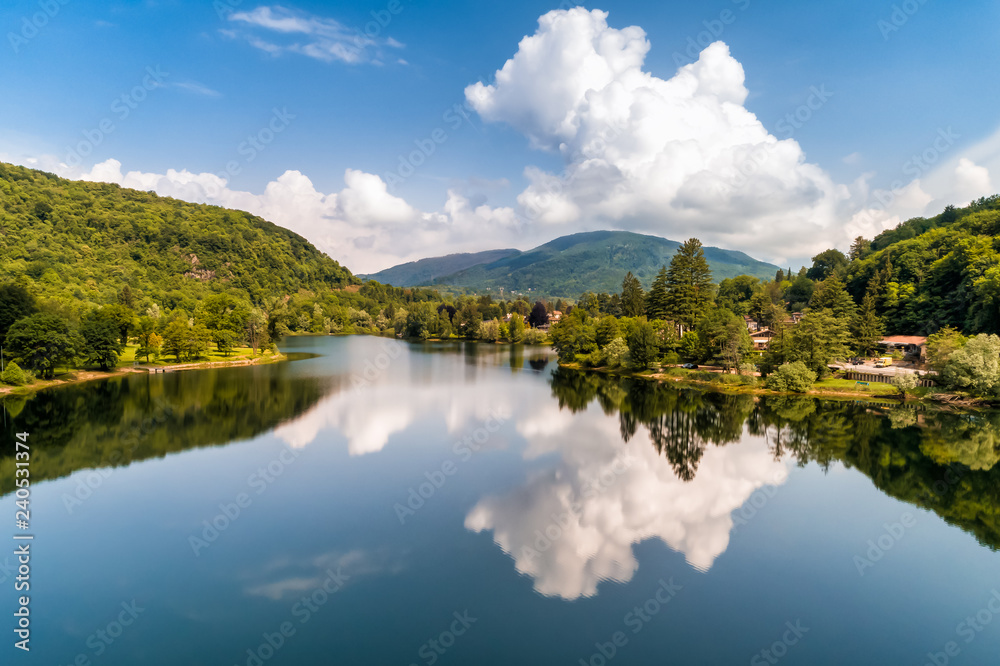 Landscape of Lake Ghirla with reflections of the clouds, Valganna in Province of Varese, Italy