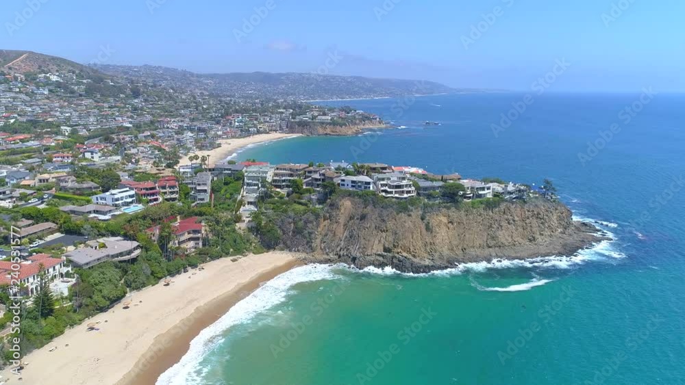 Aerial view of Laguna Beach luxury real estate in Orange County, California from above on beautiful clear blue sky day. Aerial view of Laguna Beach luxury real estate in Orange County, California from above on beautiful clear blue sky day.