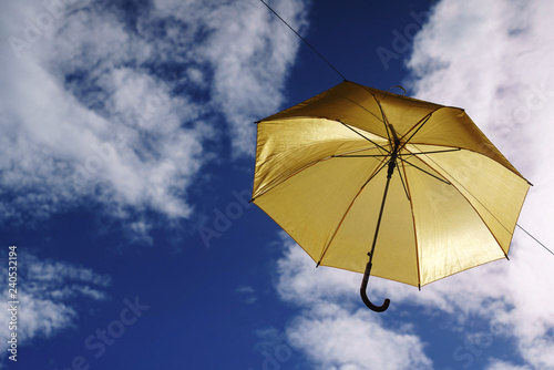 umbrella flying on a blue sky