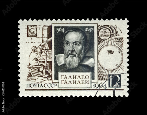 Galileo Galilei (1564-1642), famous italian astronomer, physicist and engineer, circa 1964. canceled vintage post stamp printed in USSR isolated on black background.