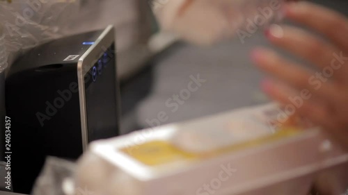 Hands cashier check out goods line