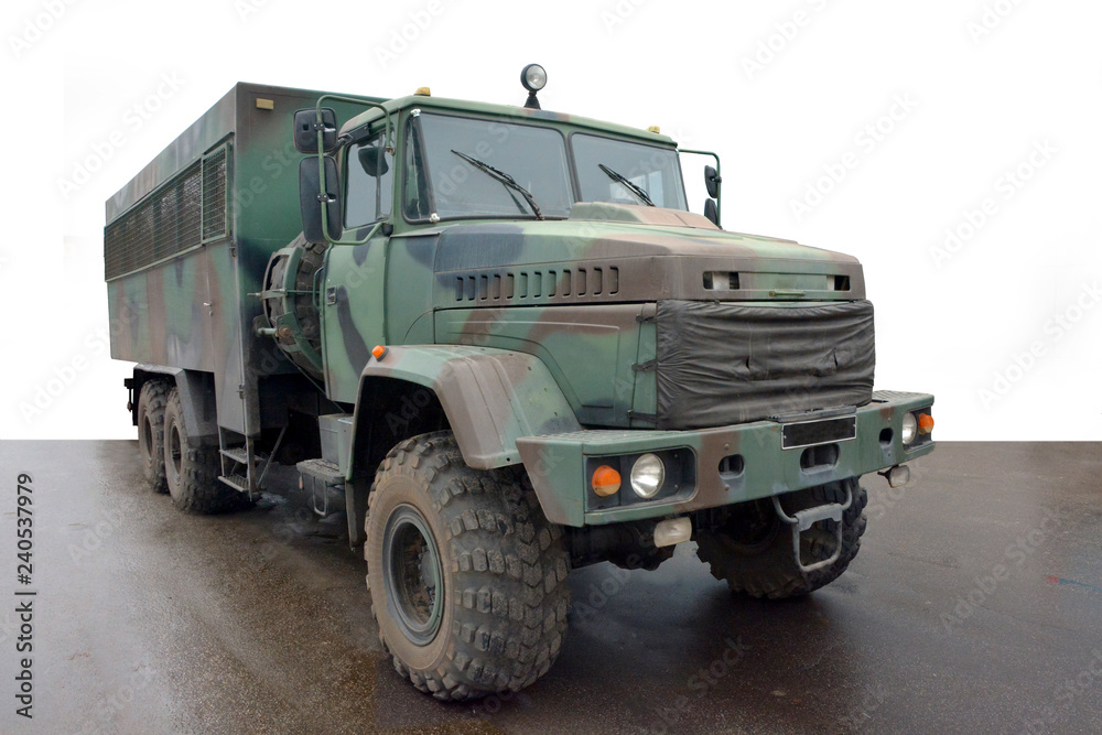 Military vehicle for transportation of soldiers. The machine has a camouflage coloring.