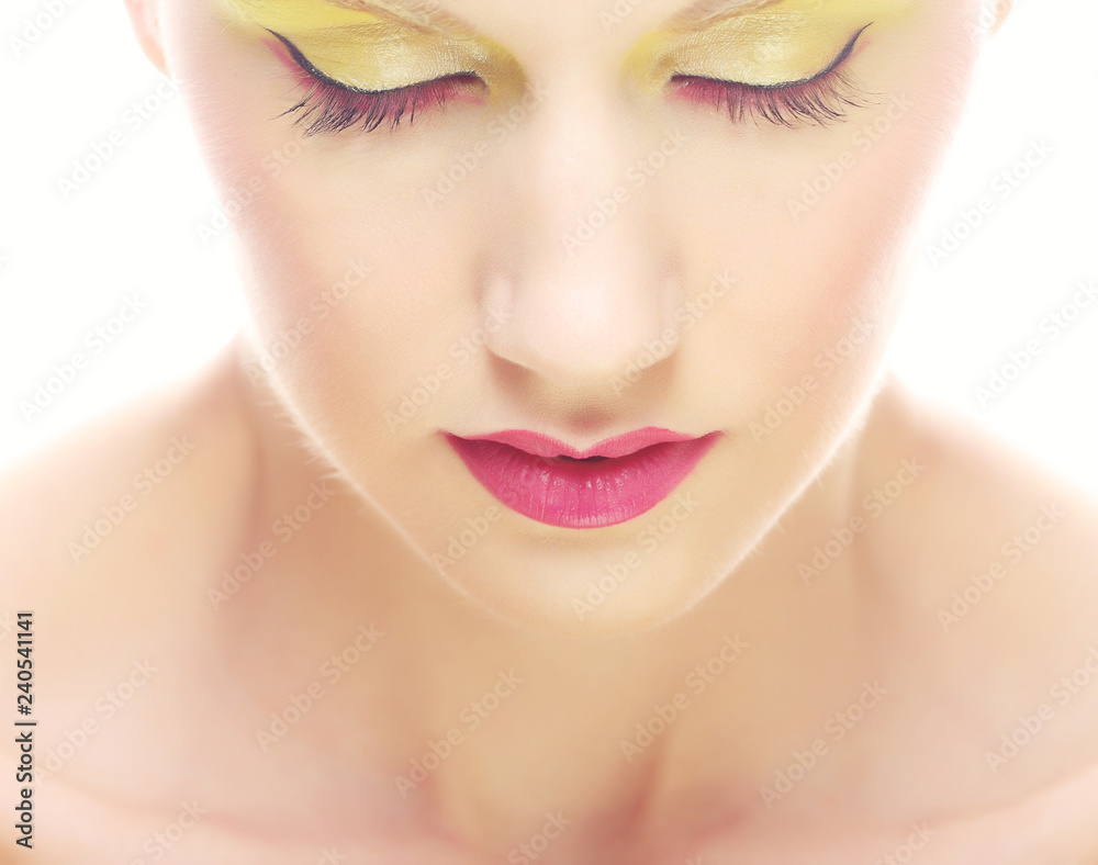 Portrait of beauty young girl with bright multicolored make-up. 