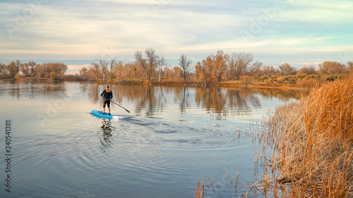 paddling stand up paddleboard