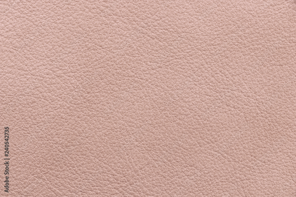 Fototapeta premium Sample texture of natural leather light pink color. Material of animal origin. Close-up.