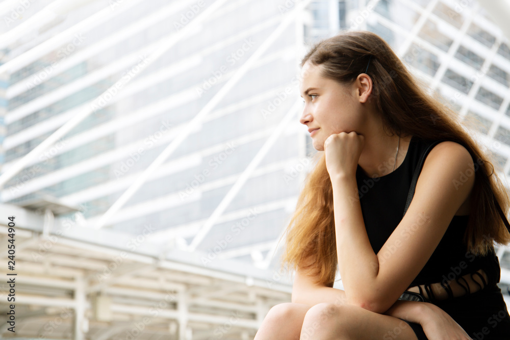 Beautiful white woman sitting relaxation and thinking on street.. Beautiful white woman sitting relaxation and thinking on street..