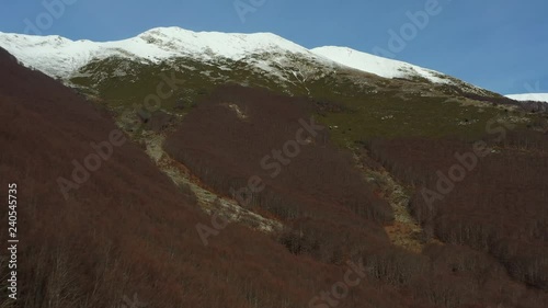 Aerial view of a beautiful snowy mouuntain in Italy. photo