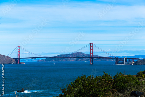The view of golden gate bridge in Lands end at San Francisco- San Francisco. summer , cloud , rock , sea, plant.