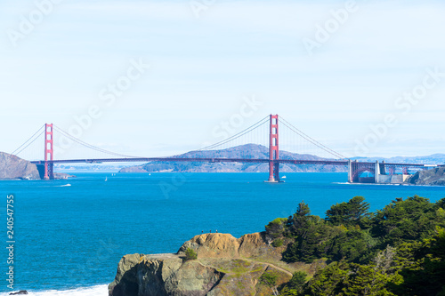 The view of golden gate bridge in Lands end at San Francisco- San Francisco. summer   cloud   rock   sea  plant.