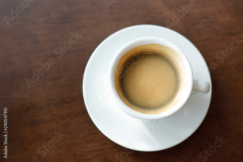 Hot coffee on wood background.. © rnophoto