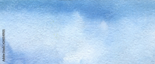 Abstract blue watercolor background. Hand painted on textured paper.