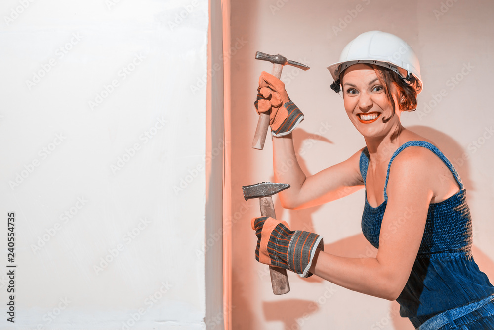 Sexy girl who is builder, painter, worker being in a renovated room Sexy girl who is builder, painter, worker being in a renovated room