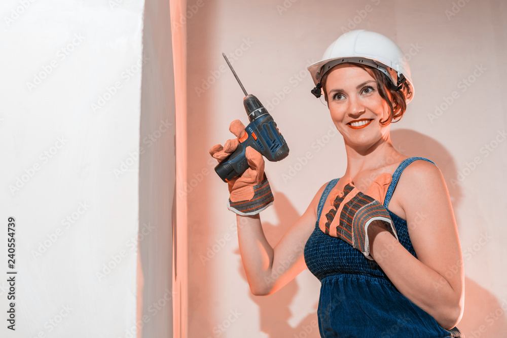 Sexy girl who is builder, painter, worker being in a renovated room Sexy girl who is builder, painter, worker being in a renovated room