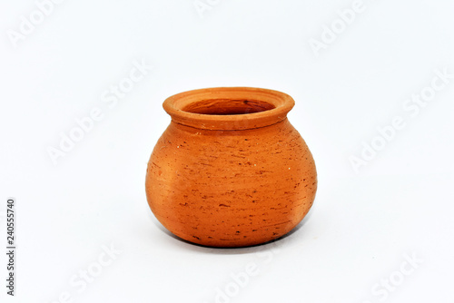 Brown-red terracotta water pot is arranged on a white background.