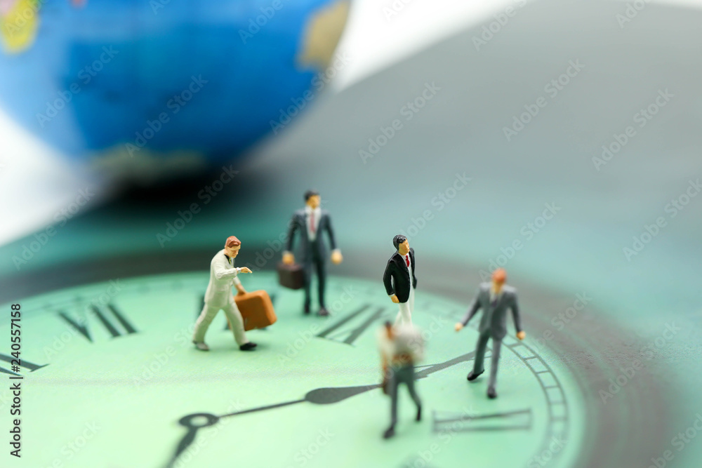 Miniature people : business man walking on the clock background, time business concept. Miniature people : business man walking on the clock background, time business concept.