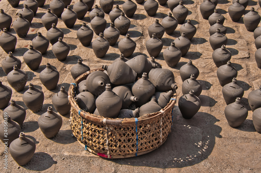 Obraz premium basket and many ceramic bottles. Ceramic Pottery in Potter Square, Bhaktapur Town, Nepal
