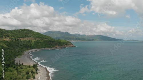 Wallpaper Mural The road along the sea Vietnam Flying camera flies over the sea shore over the road with a view of the mountains of the island. Shot from a drone. Torontodigital.ca