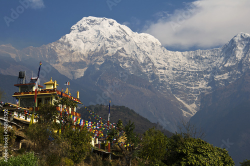 Buddhist monastery and snowy mountains. Trekking to Annapurna Base Camp photo