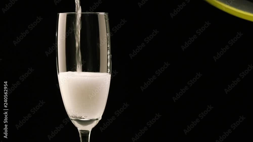 champagne pouring into glass from bottle champagne pouring into glass from bottle