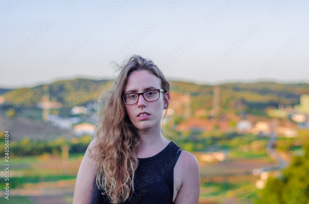 Photograph of a girl with flares on a hill in Menorca with a beautiful sunset in the background. Photograph of a girl with flares on a hill in Menorca with a beautiful sunset in the background.