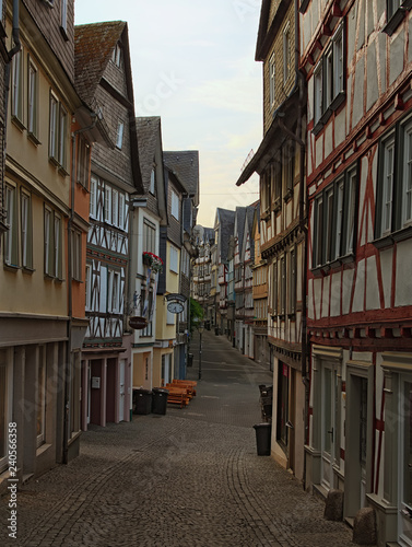 WETZLAR, GERMANY- SEPTEMBER 05, 2018: Morning landscape view of medieval street in historic part of Wetzlar city. The typical architecture for this region © evgenij84