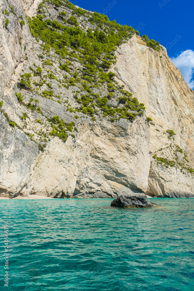 Greece, Zakynthos, Impressive huge white chalk rock wall behind azure paradise waters Greece, Zakynthos, Impressive huge white chalk rock wall behind azure paradise waters