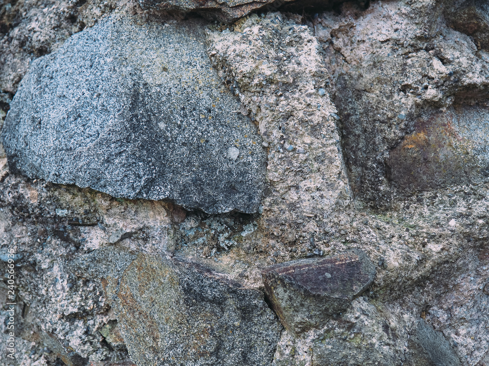 Fototapeta premium stone wall texture with cracks and patterns on the surface