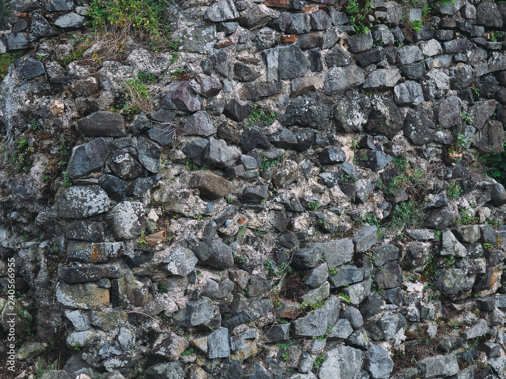 stone wall texture with cracks and patterns on the surface