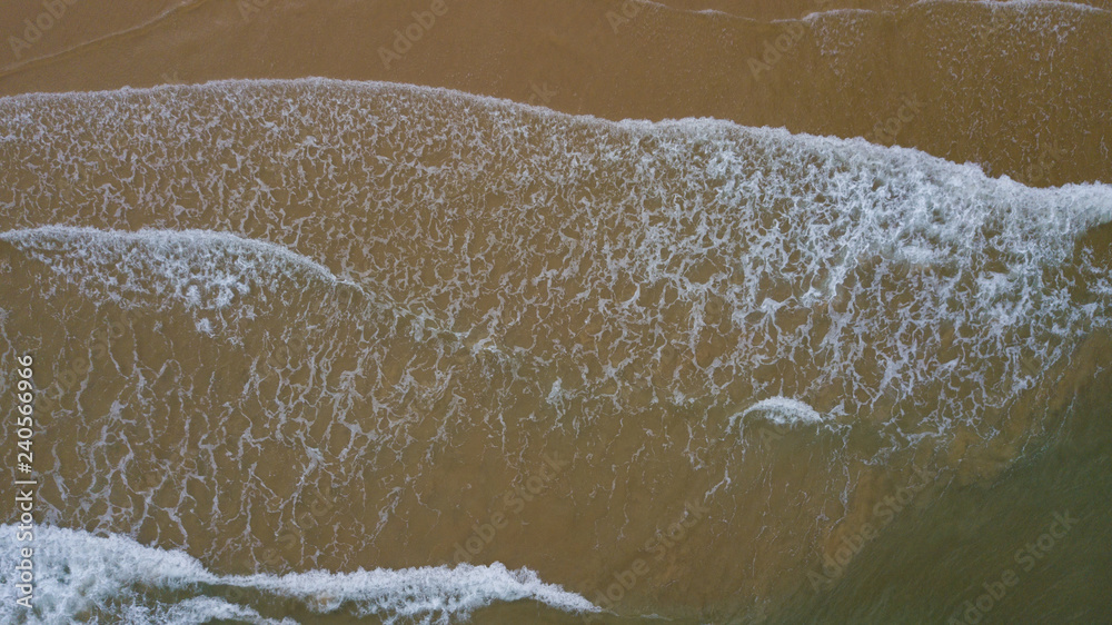 Aerial view beautiful of sea waves, sand from drone. Stock image ocean water, sea surface, sand. Top view on turquoise waves, clear water surface texture. Top view, amazing nature beach background Aerial view beautiful of sea waves, sand from drone. Stock image ocean water, sea surface, sand. Top view on turquoise waves, clear water surface texture. Top view, amazing nature beach background