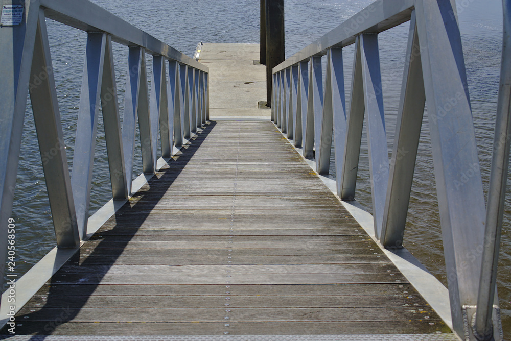 Close up view of pier with direction going down