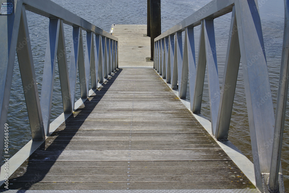 Close up view of pier with direction going down Close up view of pier with direction going down
