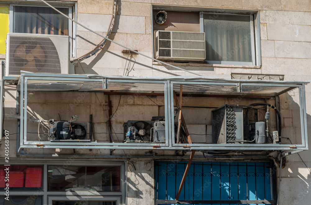 Air conditioner and refrigerator motors hanging on a wall Air conditioner and refrigerator motors hanging on a wall