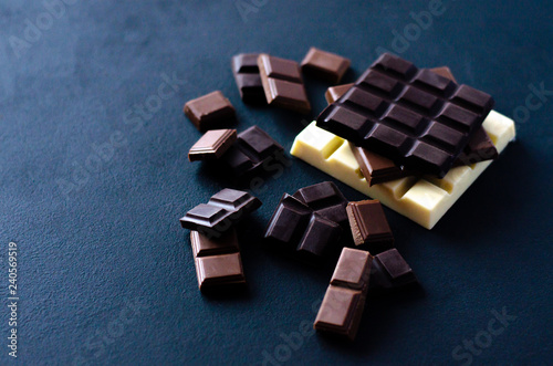 Different beautiful chocolate on a black background.