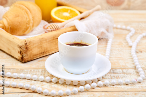 Good morning. Continental breakfast on ristic wooden background.