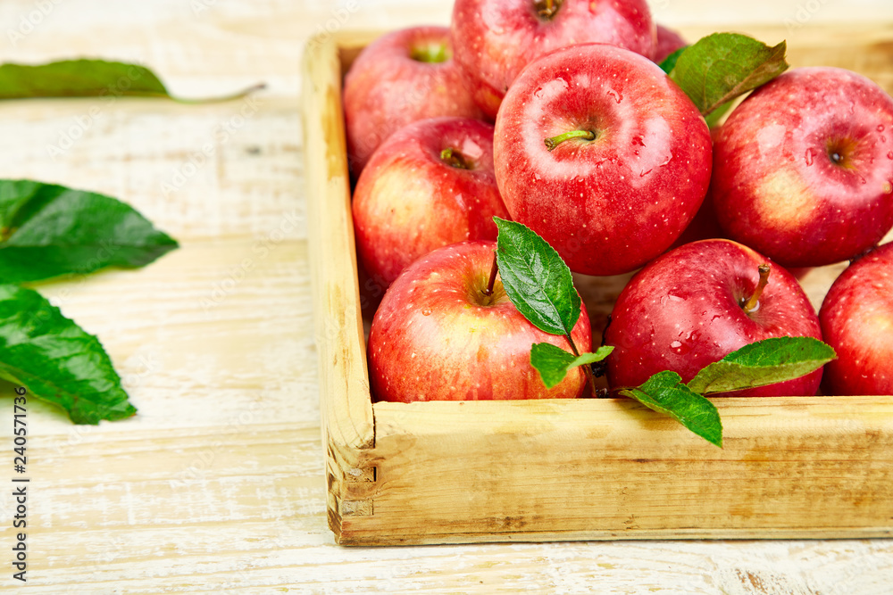Fresh red ripe apples fruits in the wooden box Fresh red ripe apples fruits in the wooden box