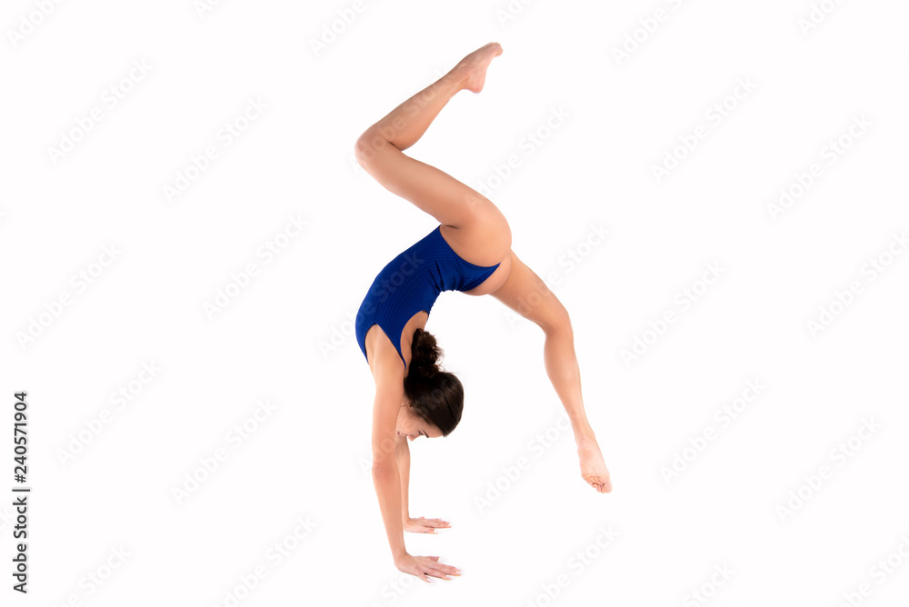 Beautiful young flexible girl splits stretch workout